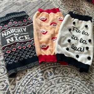 Three small dog holiday sweaters